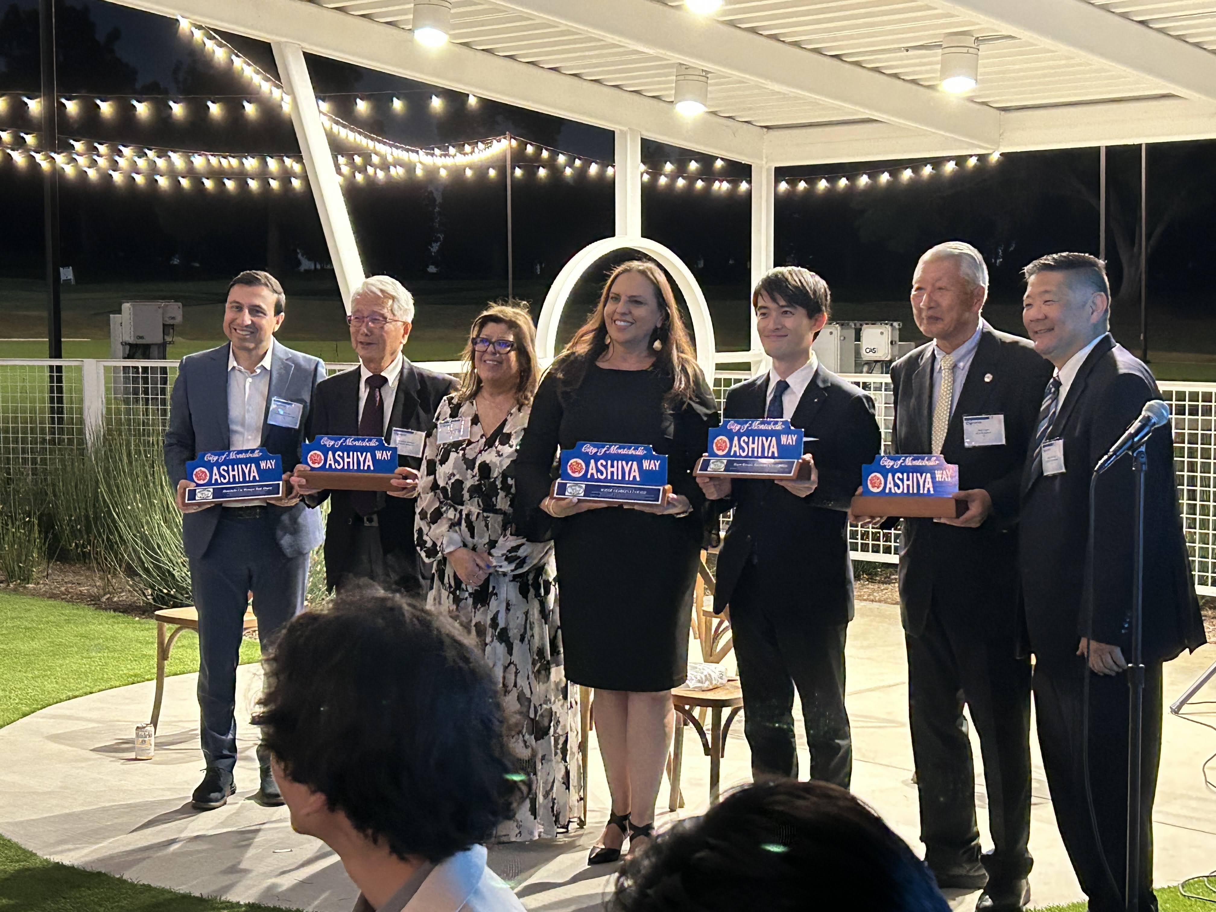Montebello and Ashiya representatives holding commemorative Ashiya Way awards