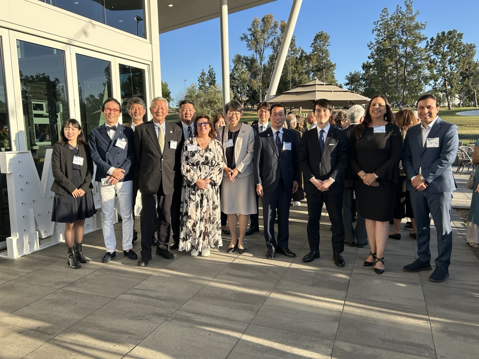 Montebello and Ashiya delegation members standing together outdoors