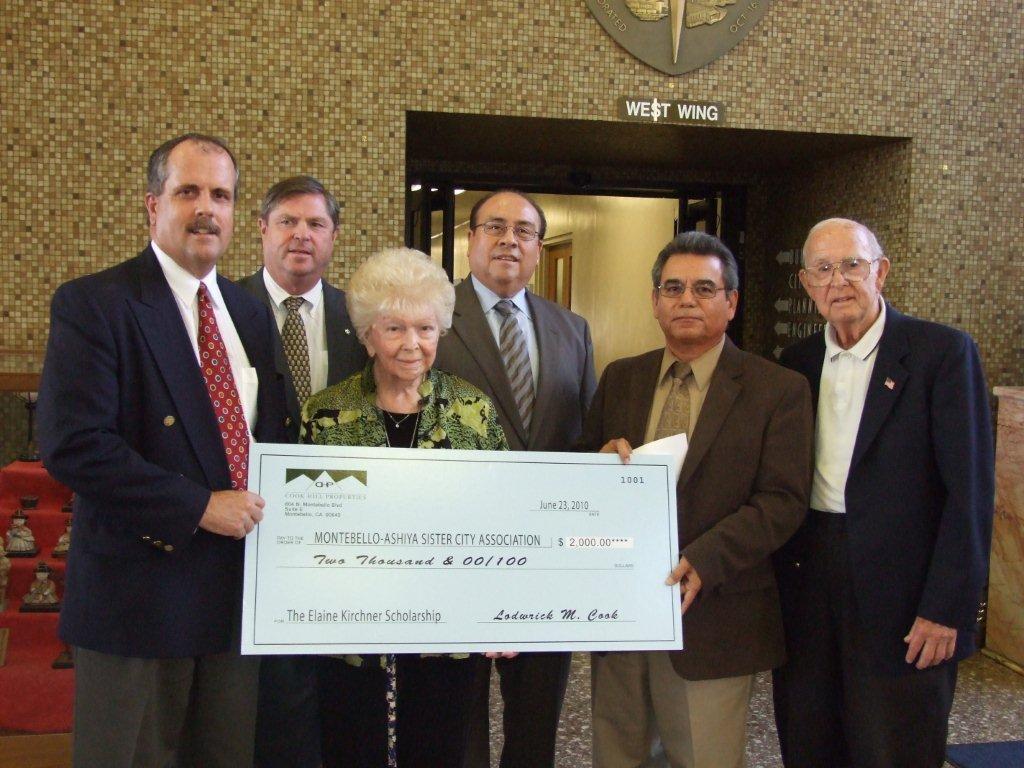 Elaine Kirchner and MASCA supporters presenting a scholarship donation check in 2010